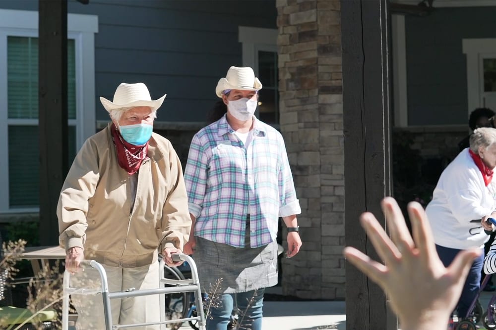 Two residents in masks at a Anthology Senior Living location